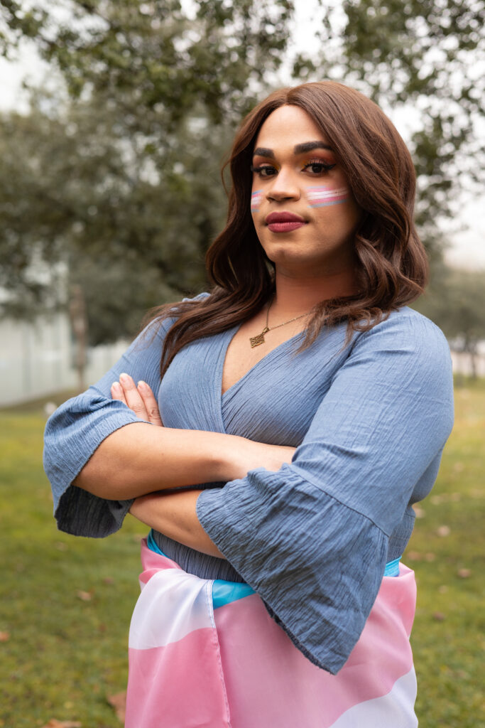 trans woman standing with trans flag serious and 2024 02 19 20 14 21 utc mental health mental health,trans women