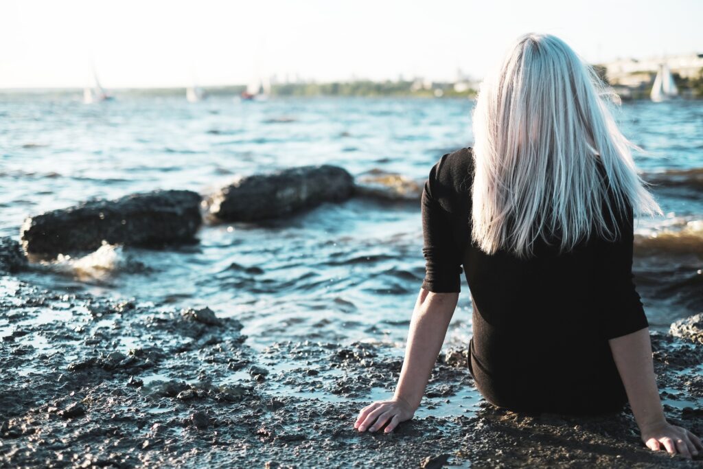 the girl with blond hair sits back on shore of lak 2023 11 27 05 37 18 utc Gender-specific treatment programs Gender-specific treatment programs,women's addiction treatment,specialized addiction recovery