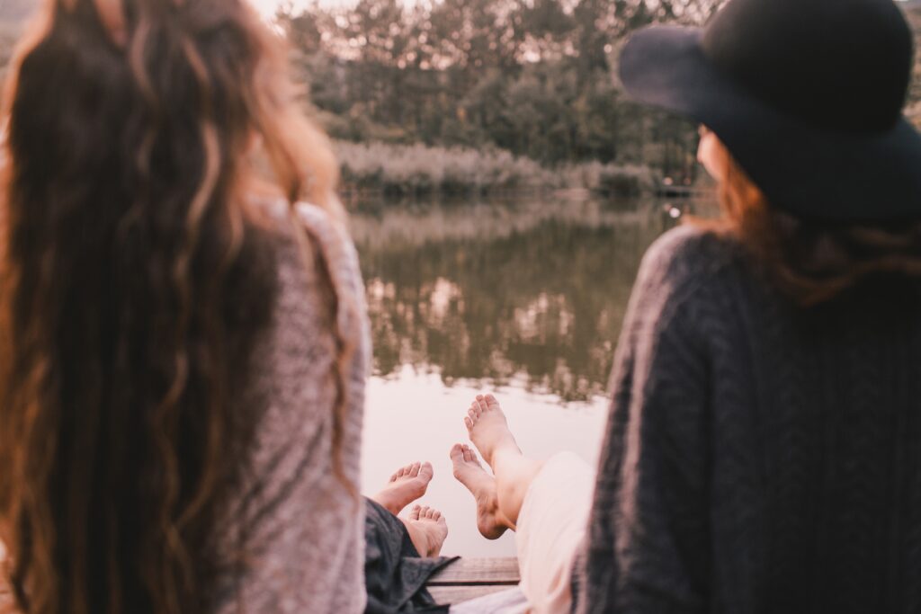 two women friends enjoying sunset sitting near lak 2023 11 27 05 30 43 utc Gender-specific treatment programs Gender-specific treatment programs,women's addiction treatment,specialized addiction recovery